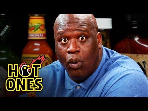 Shaq Tries to Not Make a Face While Eating Spicy Wings
